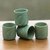 Ceramic cups, 'Bay Leaf' (set of 4) - Green Tea Cups with Leaf Motifs (Set of 4) thumbail