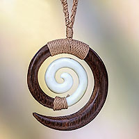 Wood pendant necklace, 'Hypnotic Borneo' - Hand Carved Wood and Bone Macrame Necklace
