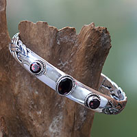 Garnet cuff bracelet, 'Three Guardians' - Braided Sterling Silver Cuff Bracelet with Three Garnets