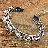 Blue topaz cuff bracelet, 'Java Kawung' - Silver and Blue Topaz Cuff Style Bracelet from Bali