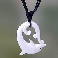 Bone pendant necklace, 'Lonely Dolphin' - Dolphin Carved Bone Pendant Necklace on Black Cord