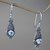 Blue topaz dangle earrings, 'Blue Cephalopod' - Oxidized Silver and Blue Topaz Squid Shaped Earrings thumbail