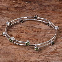 Peridot bangle bracelet, 'Orchid Twist in Green' - Hand Made Sterling Silver Peridot Bangle Bracelet Indonesia
