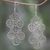 Sterling silver chandelier earrings, 'Dancing Lace Medallions' - Feminine Sterling Silver Chandelier Earrings Crafted in Bali thumbail