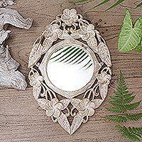Wood wall mirror, 'Jembrana Frangipani' - Hand-Carved Wood Round Floral Wall Mirror from Bali