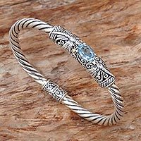 Gold accented blue topaz bangle bracelet,