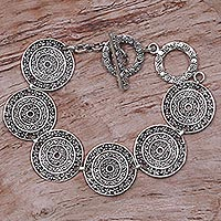 Sterling silver link bracelet, 'Frangipani Altar' - Sterling Silver Handcrafted Disc Link Bracelet