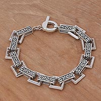 Sterling silver link bracelet, 'Daring Swirls' - Indonesian Sterling Silver Link Bracelet with Swirl Motifs