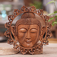 Suar wood wall panel, 'Buddha Face' - Hand Carved Buddha Face Wall Panel with Floral Engravings