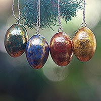 Wood ornaments, 'Golden Eggs' (set of 4) - Four Gold Tone Albesia Wood Egg Shaped Ornaments from Bali