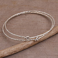 Sterling silver bangle bracelets, 'Why Knot' (pair) - Pair of 925 Sterling Silver Bangle Bracelets from Bali