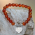 Carnelian beaded stretch bracelet, 'Loving Fantasy' - Red Carnelian Heart Charm Beaded Bracelet from Bali thumbail