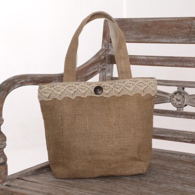 Jute tote bag, 'Malioboro Grove' - Natural Jute Tote Bag with Lace Trim and Coconut Shell