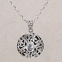 Blue topaz pendant necklace, 'Floral Eye in Blue' - Artisan Handmade 925 Sterling Silver Topaz Pendant Necklace