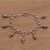 Sterling silver charm bracelet, 'Captivate' - Hand Crafted Sterling Silver Charm Bracelet thumbail