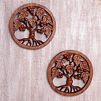 Wood relief panels, 'Berry Trees' (pair) - Tree-Themed Suar Wood Relief Panels (Pair) from Bali