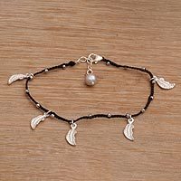 Sterling silver charm bracelet,