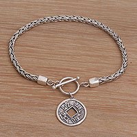 Sterling silver charm bracelet,
