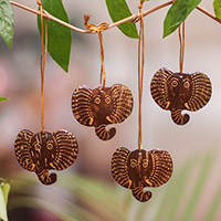 Coconut shell ornaments, 'Elephant with Golden Tusks' (set of 4) - Set of 4 Handmade Coconut Shell Elephant Ornaments