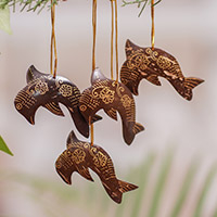 Coconut shell ornaments, 'Dolphin Echo' (set of 4) - Set of 4 Handmade Brown Coconut Shell Dolphin Ornaments