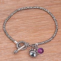 Blue topaz and amethyst charm bracelet,