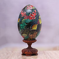 Wood statuette, 'In the Reef' - Hand-Painted Colorful Fish on Black Wood Egg Statuette