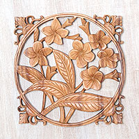 Wood relief panel, 'Bali Plumeria' - Hand-Carved Floral Suar Wood Relief Panel from Bali