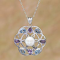 Blue topaz and amethyst pendant necklace, 'Matahari' - Blue Topaz and Amethyst Sun Face Pendant Necklace from Bali