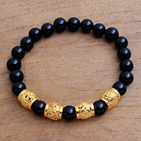 Men's gold accented onyx beaded stretch bracelet, 'Batur Heritage' - Men's Gold Accented Onyx Beaded Stretch Bracelet from Bali