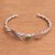 Peridot cuff bracelet, 'Love Takes Wing' - Sterling Silver Wing and Heart Peridot Cuff Bracelet thumbail