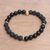 Gold accented onyx beaded stretch bracelet, 'Dark Skull' - Gold Accented Onyx Skull Beaded Stretch Bracelet from Bali thumbail