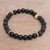 Gold accented onyx beaded stretch bracelet, 'Dark Skull' - Gold Accented Onyx Skull Beaded Stretch Bracelet from Bali (image 2b) thumbail