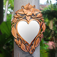 Wood wall mirror, 'Jepun Heart' - Heart-Shaped Frangipani Flower Wood Wall Mirror from Bali