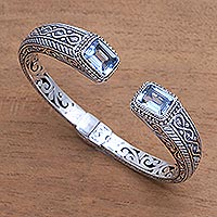 Blue topaz cuff bracelet, 'Sukawati Helix' - Helix Pattern Blue Topaz Cuff Bracelet from Bali