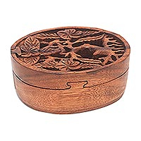 Wood puzzle box, 'Plumeria Oval' - Floral Suar Wood Puzzle Box from Bali