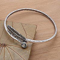 Blue topaz bangle bracelet, 'Sky Feather' - Handcrafted Sterling Silver Bangle Bracelet with Blue Topaz