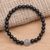 Onyx and sterling silver beaded stretch bracelet, 'Ornate Medallion in Black' - Hand Crafted Onyx Stretch Bracelet with Silver Pendant thumbail