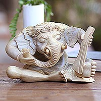 Hibiscus wood sculpture, 'Ganesha with Manuscript' - Hand Carved Hibiscus Wood Ganesha Sculpture