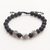 Sterling silver lava stone unity bracelet, 'Helping Hands Together' - Balinese Sterling Silver Black Lava Stone Unity Bracelet thumbail