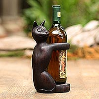 Suar wood wine holder, 'Black Cat Hug' - Hand Crafted Suar Wood Cat Wine Holder