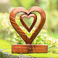 Wood statuette, 'Two Loves in Brown' - Hand Carved Natural Suar Wood Heart Statuette