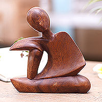 Wood statuette, 'Unwind' - Suar Wood Statuette