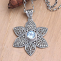 Blue topaz pendant necklace, 'Blue Desire' - Blue Topaz Pendant Necklace with Floral Motif