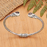 Garnet cuff bracelet, 'Perseverance Fates' - Balinese Sterling Silver Cuff Bracelet with Garnet Gems