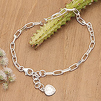 Sterling silver charm bracelet, 'Radiant Heart' - Polished Sterling Silver Charm Bracelet with Heart Charm