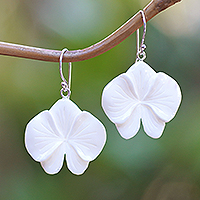 Hand-carved dangle earrings, 'Snowy Orchid' - Hand-Carved Orchid Bloom-Shaped Dangle Earrings