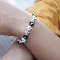 Gold-accented crystal beaded bracelet, 'Classic Petals' - Handcrafted Floral Black and White Crystal Beaded Bracelet