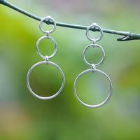 Sterling silver dangle earrings, 'Circle Crescendo' - Silver Dangle Earrings with Intertwined Triple Circle Motif