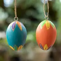Wood ornaments, 'Colorful Holiday Eggs' (pair) - 2 Colorful Hand-Carved Painted Wood Egg Christmas Ornaments