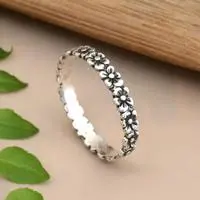 Sterling silver band ring, 'Row of Blooms' - Floral Textured Sterling Silver Band Ring from Bali